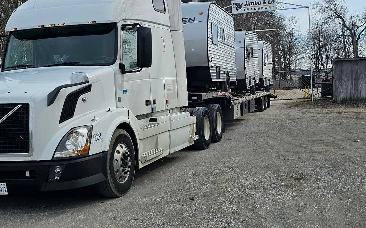 A Jimbo semi hauling multiple RV units in one trip